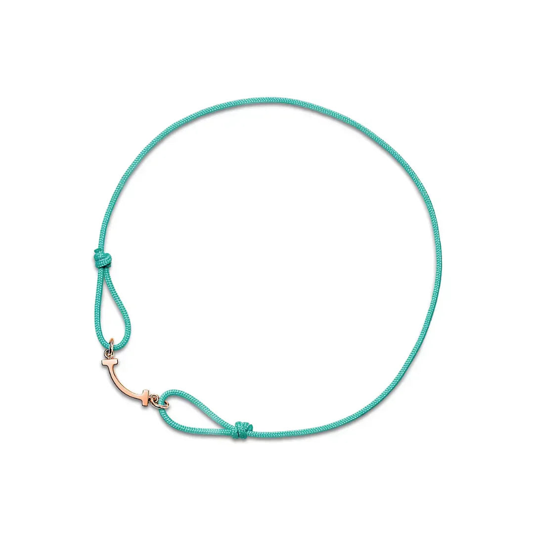 T Smile Bracelet with Rose Gold on a Blue Cord
